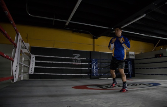 Kenneth shadow boxing for the first time since his accident. An accomplishment since two months ago he barely was able to walk on his own. Photo by Randy Vazquez