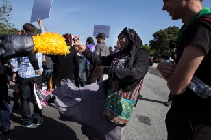 Rabia Keeble kicks her Donald Trump piñata outside of the GOP Convention in Burlingame, Calif. on April 29, 2016. Trump was the keynote speaker during the event. (Randy Vazquez)