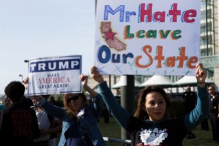 A lone Donald Trump supporter endorses the GOP front-runner in a sea of protesters at the GOP Convention in Burlingame, Calif. on April 29, 2016. (Randy Vazquez)