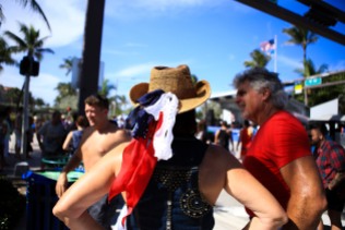 People decorate themselves in the colors of the American flag during the July 4th Celebration at Delray Beach on Monday.The event featured live music, family activities, and competitive eating. Randy Vazquez, Sun Sentinel