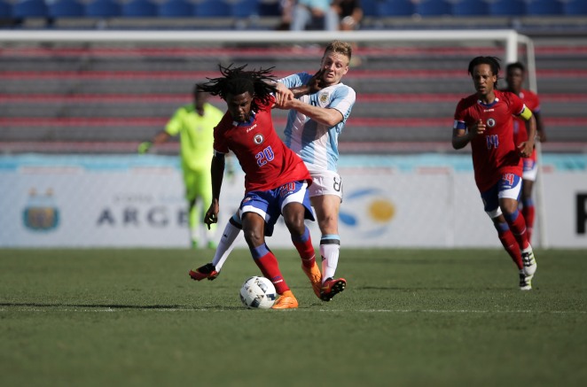 Junior Delva of Haiti fends off a defender during a friendly versus Argentina at Florida Atlantic University Stadium on Sunday, July 24, 2016. Argentina would go on to win 3-1. Randy Vazquez, Sun Sentinel