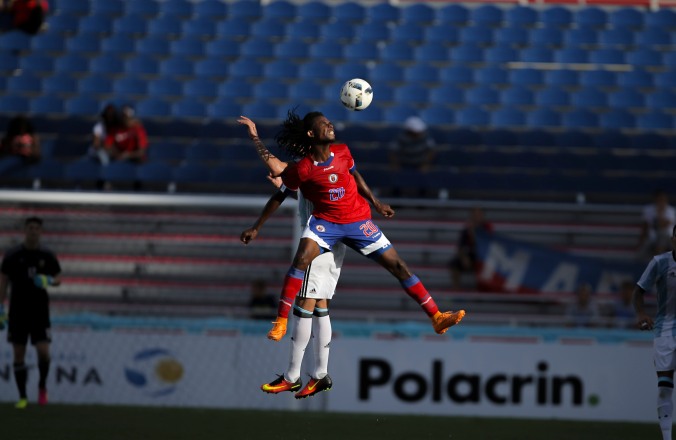 Junior Delva of Haiti jumps over defender to gain possession of the ball during a friendly versus Argentina at Florida Atlantic University Stadium on Sunday, July 24, 2016. Argentina would go on to win 3-1. Randy Vazquez, Sun Sentinel
