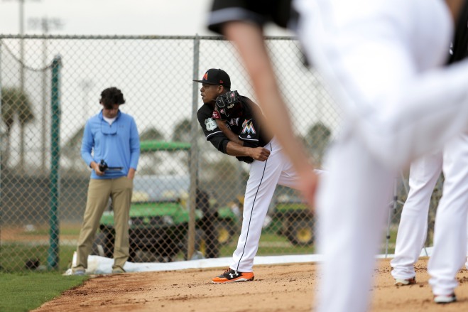 Miami Marlins pitchers and catchers began spring training Tuesday at Roger Dean Stadium in Jupiter. Pitcher Edinson Volquez throws some pitches during the first day of training. Other positions groups also showed up to workout. Randy Vazquez, South Florida Sun-Sentinel