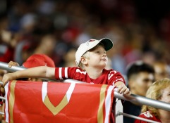 A young San Francisco 49ers fan looks up at the big screen in the fourth quarter his teams preseason NFL game versus the Dallas Cowboys at Levi's Stadium in Santa Clara, Calif., on Thursday, Aug. 9, 2018. (Randy Vazquez/ Bay Area News Group)