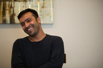 Muhammad Shakeel Naqvi smiles in his home in Menlo Park, Calif., on Tuesday, July 17, 2018. Naqvi rents a room from his employer Zareen Khan, owner of Zareen's Restaurant. Khan offers below-market rent to four of her key, full time employees. It's a unique way for a small business to keep its employees. (Randy Vazquez/ Bay Area News Group)