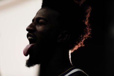 Jordan Bell sticks out his tongue for a photo during Golden State Warriors Media Day in Oakland, Calif., on Monday, Sep. 24, 2018. (Randy Vazquez/Bay Area News Group)