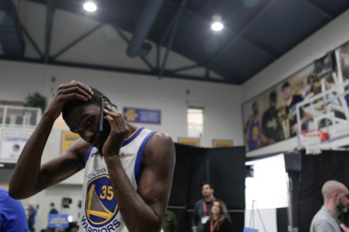 Kevin Durant takes a phone call during Golden State Warriors Media Day in Oakland, Calif., on Monday, Sep. 24, 2018. (Randy Vazquez/Bay Area News Group)