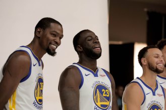 Kevin Durant, left, Draymond Gree, center, and Stephen Curry, right, laugh while taking a photo during Golden State Warriors Media Day in Oakland, Calif., on Monday, Sep. 24, 2018. (Randy Vazquez/Bay Area News Group)