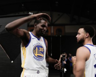 Kevin Durant, left, talks to Stephen Curry, right, during Golden State Warriors Media Day in Oakland, Calif., on Monday, Sep. 24, 2018. (Randy Vazquez/Bay Area News Group)
