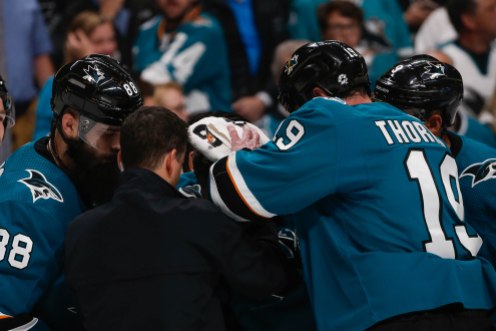 SAN JOSE, CA - APRIL 23: San Jose Sharks' Joe Thornton (19), right, appears to covers up teammate Joe Pavelski's (8) injury in the third period of Game 7 of their NHL first round playoff series versus the Vegas Golden Knights at the SAP Center in San Jose, Calif., on Tuesday, April 23, 2019. (Randy Vazquez/Bay Area News Group)
