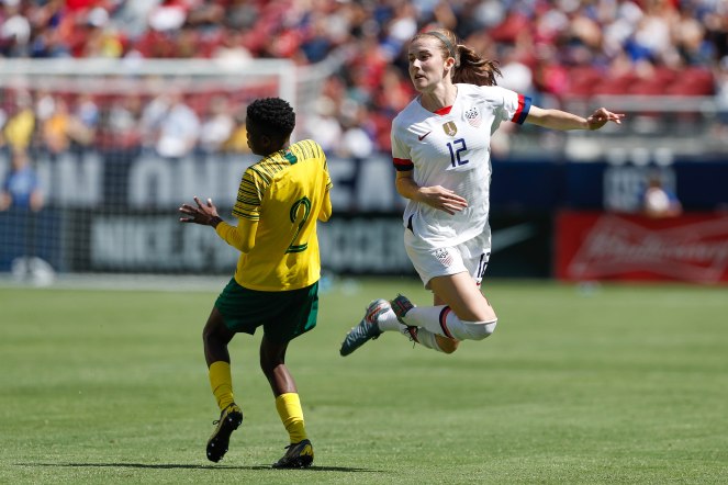 United States defender Tierna Davidson (12), right, leaps around South Africa's Lebohang Ramalepe (2), left, during the second half of their friendly game at Levi's Stadium in Santa Clara, Calf., on Sunday, May 12, 2019. (Randy Vazquez/Bay Area News Group)