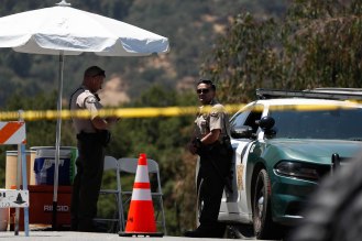 San Benito Sheriff's officers set a perimeter around Christmas Hill Park in Gilroy, Calif., on Monday, July 30, 2019. The park was the location of the Gilroy Garlic Festival where a gunman opened fire killing three people. (Randy Vazquez/Bay Area News Group)